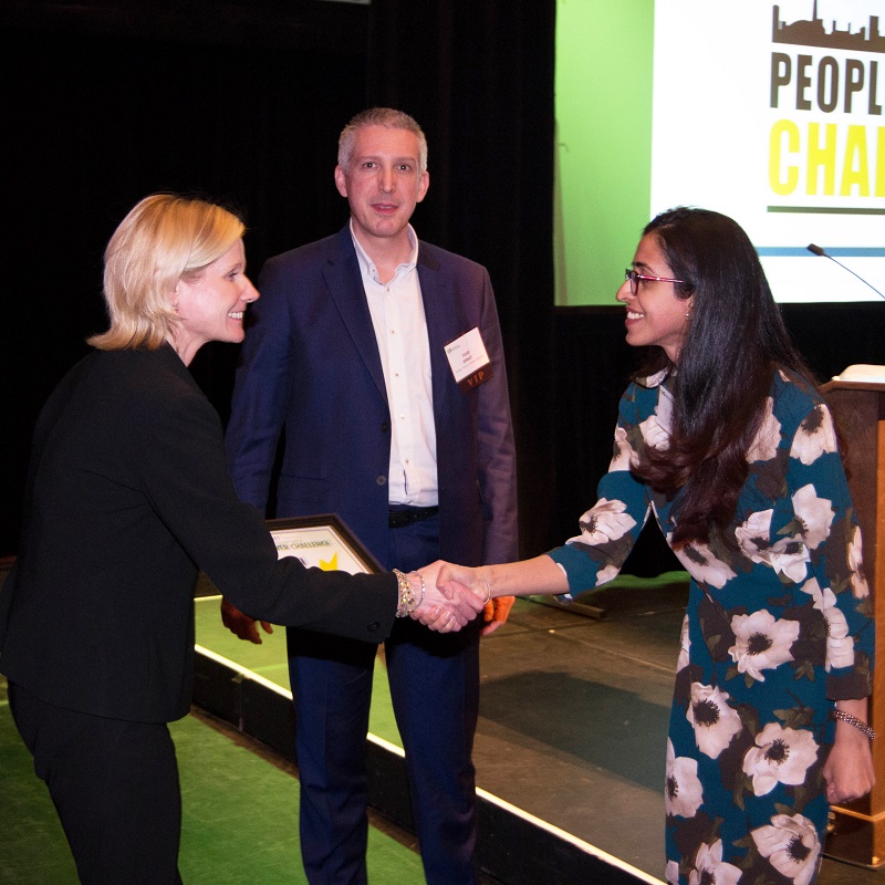 Partners in Project Green manager Dianne Zimmerman congratulates People Power Challenge winner
